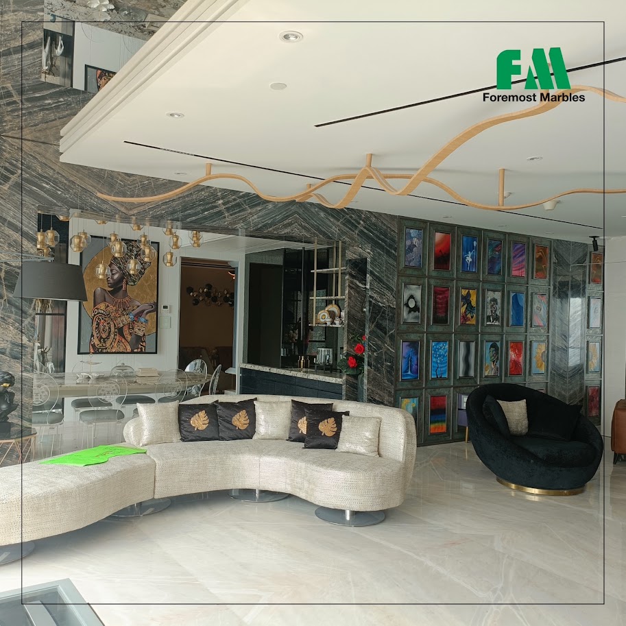 Modern living space featuring elegant furniture, artistic decor, and a stylish marble backdrop, showcasing Foremost Marbles' projects.