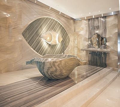 Luxurious bathroom featuring a unique shell-shaped bathtub and elegant stone accents, showcasing modern design elements.