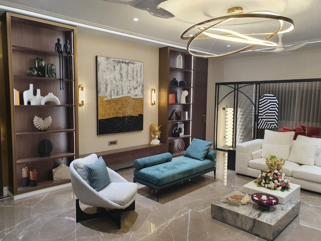 Modern living room featuring stylish furniture, decorative shelves, and artistic accents for a sophisticated ambiance.
