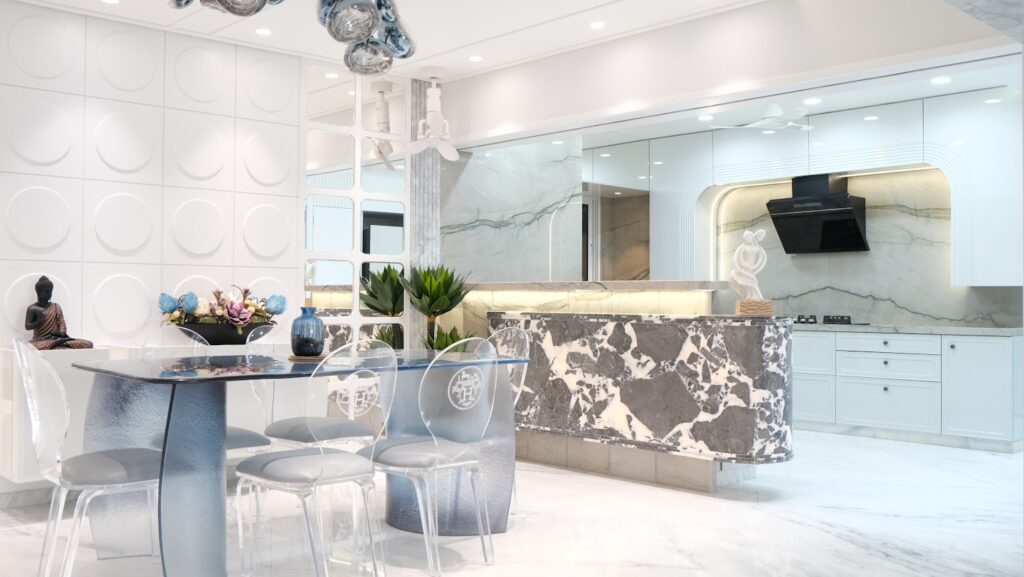 Modern kitchen and dining area featuring sleek marble surfaces, transparent chairs, and elegant decor elements.