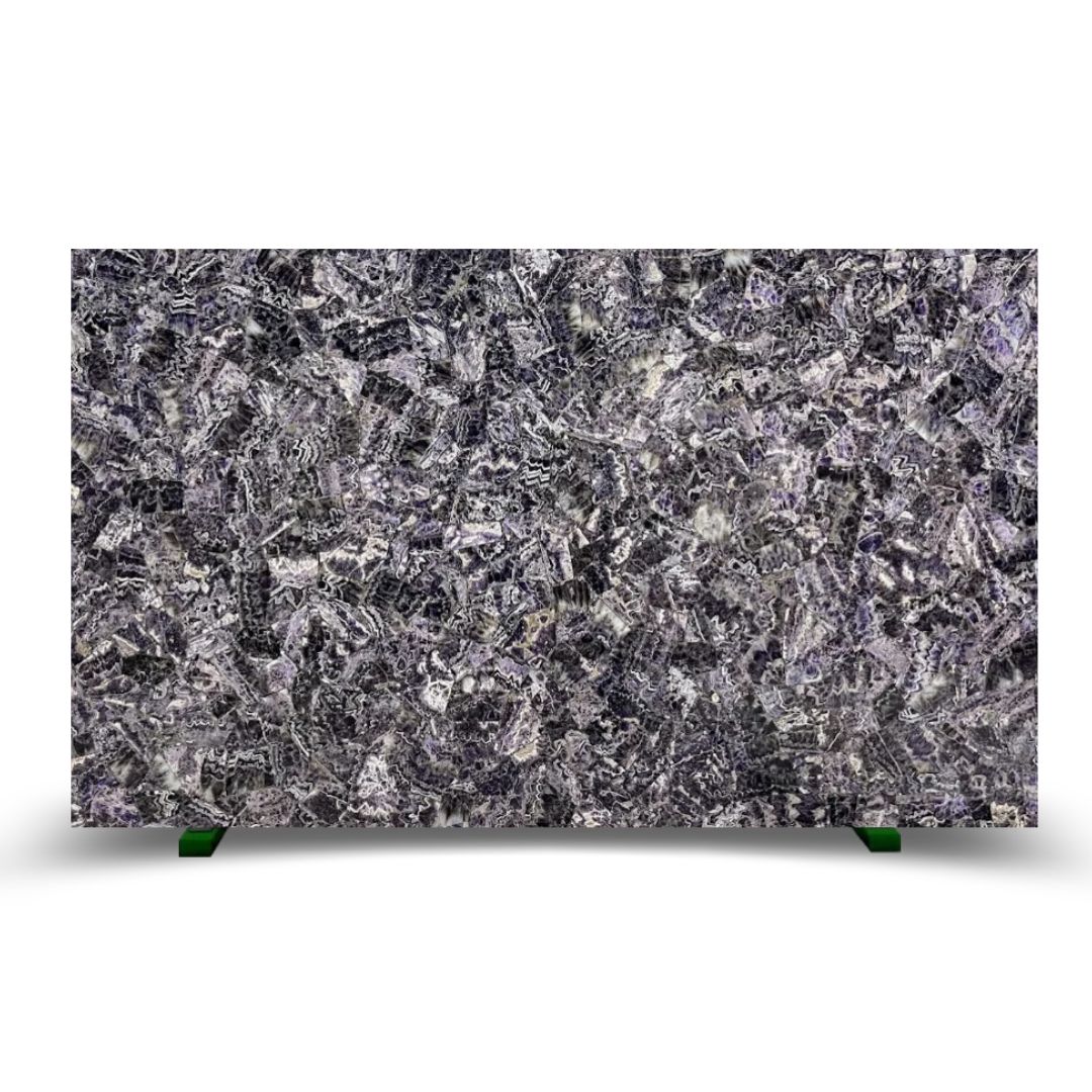 Textured surface of dark stone with intricate veining in shades of purple and gray, evoking a mythic presence.